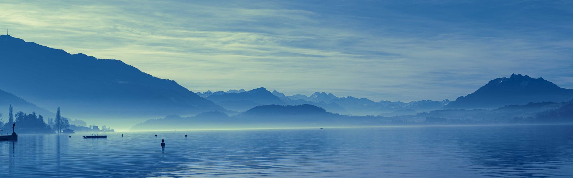 Beautiful view of Lake Zug framed by Mount Rigi and Mount Pilatus.